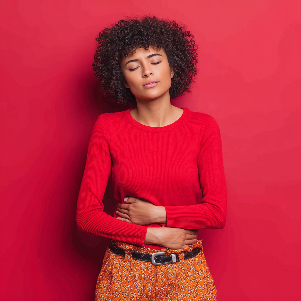 Woman experiencing abdominal discomfort representing urgent women's health concerns